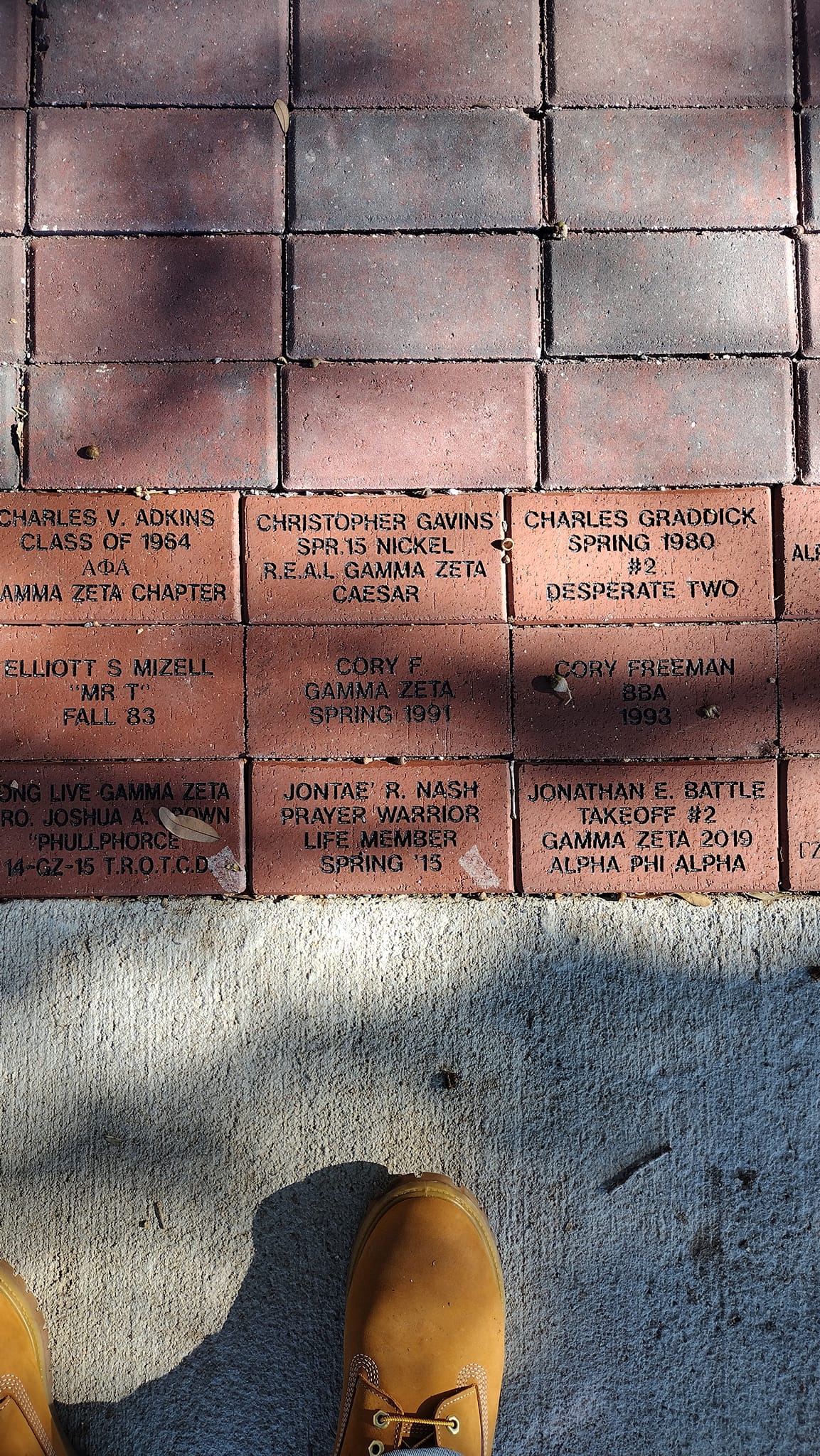 Engraved Legacy Walk bricks honoring generations of Gamma Zeta brothers and their lines.